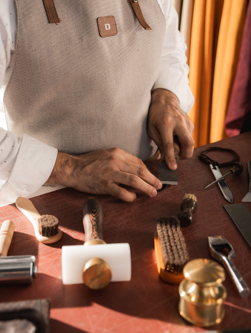 Artisan hand-stitching leather in the Danilos atelier